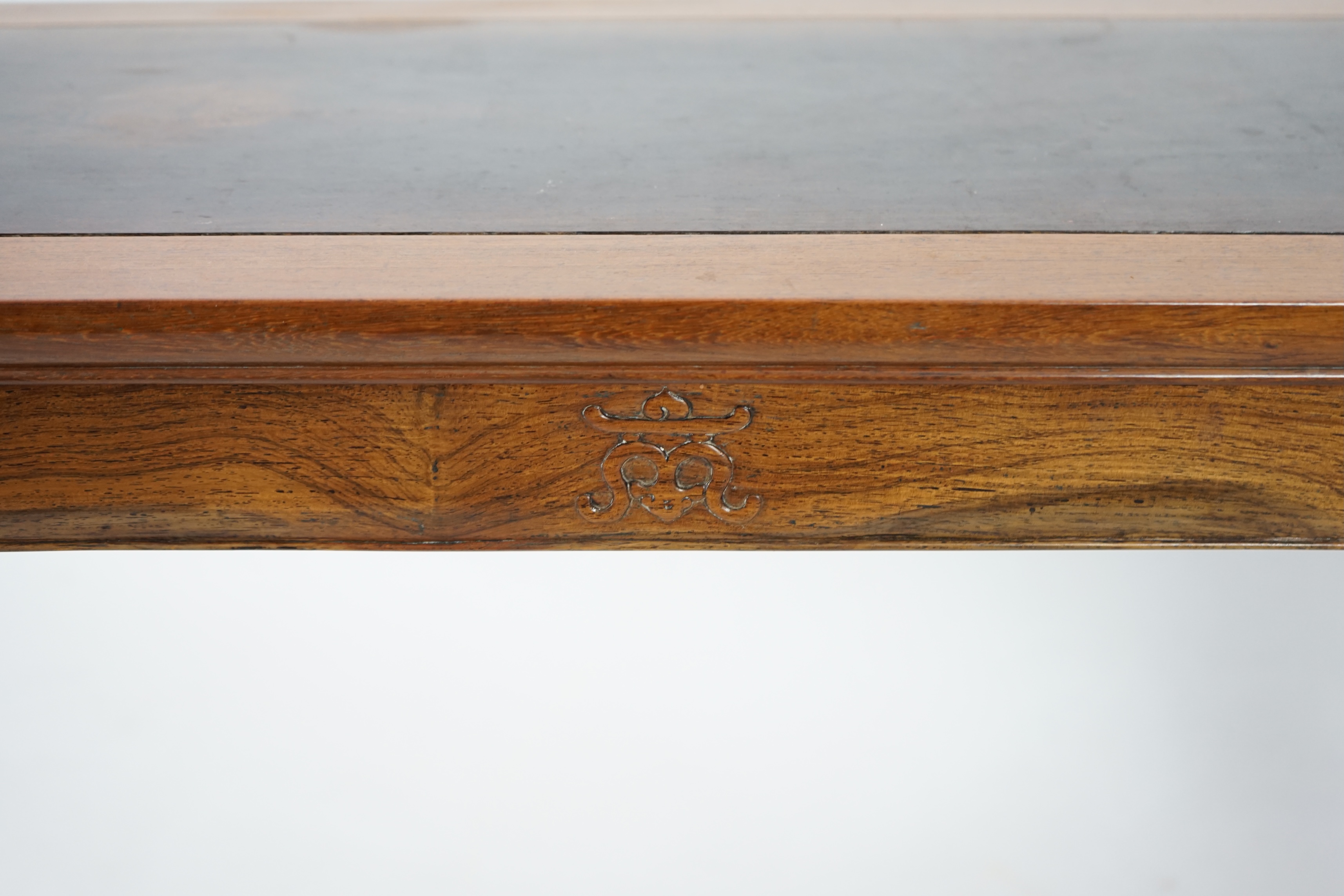 A Chinese padouk wood and jichimu altar table, the panelled rectangular top with scroll ends, on plain uprights headed by ruyi, 185cm wide, 94cm high. Condition - fair to good